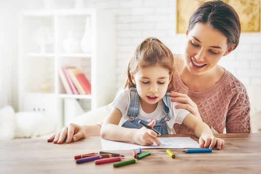 Mother and daughter together paint stock photo