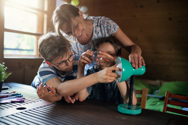 Mother and kids saving energy by changing bulbs Mother teaching kids how important is to use energy-efficient light sources. The kids are changing the old incandescent build for modern energy saving LED bulb.
Nikon D850 energy efficient stock pictures, royalty-free photos & images