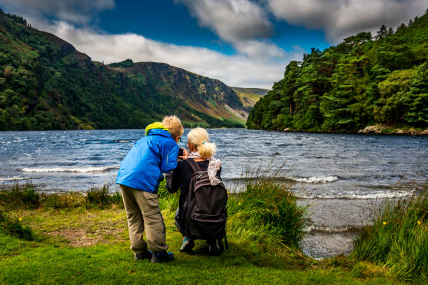 mother and son at Glendalough Upper Lake mother and son at Glendalough Upper Lake killarney ireland stock pictures, royalty-free photos & images