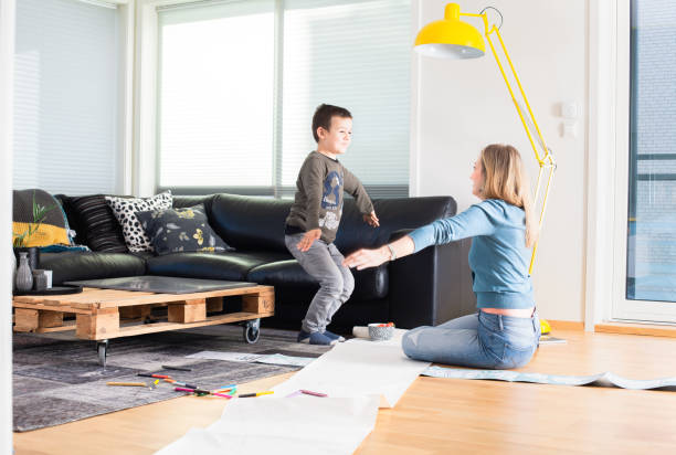 Mother and son home alone for weekend stock photo