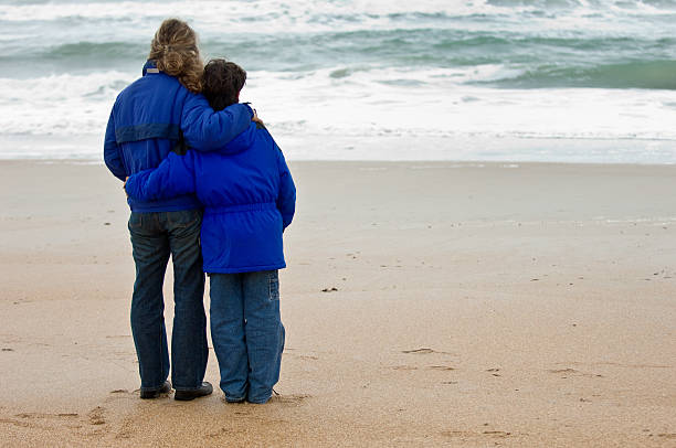 Mother and son  divorce beach stock pictures, royalty-free photos & images