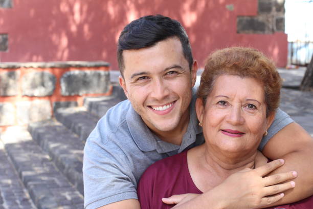 Mother and son smiling outdoors Mother and son smiling outdoors. columbian woman stock pictures, royalty-free photos & images