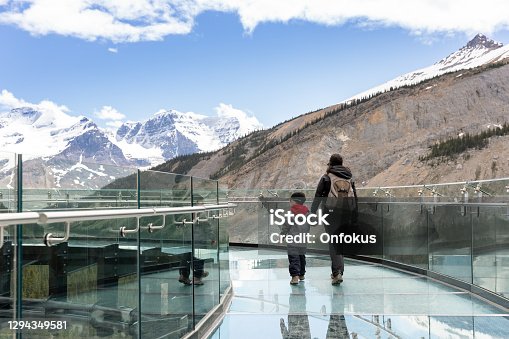 istock Mother and Son Waking on Columbia Icefield  Skywalk During Summer in Jasper National Park 1294349581