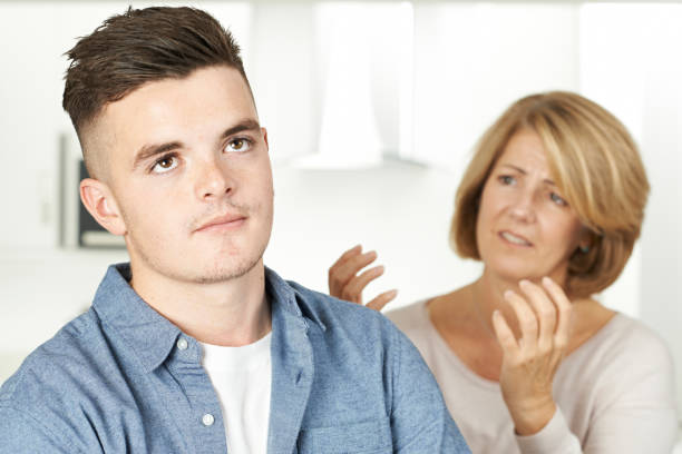 Mother Arguing With Teenage Son Mother Arguing With Teenage Son mother and teenage son stock pictures, royalty-free photos & images
