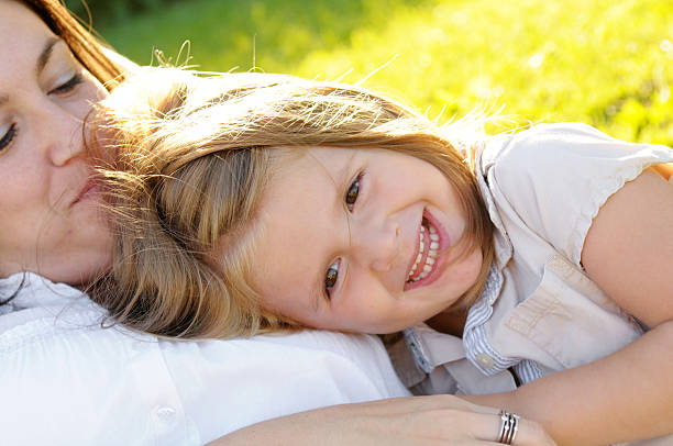 Mother & Daughter A mother and daughter playing together outside. mother and child stock pictures, royalty-free photos & images