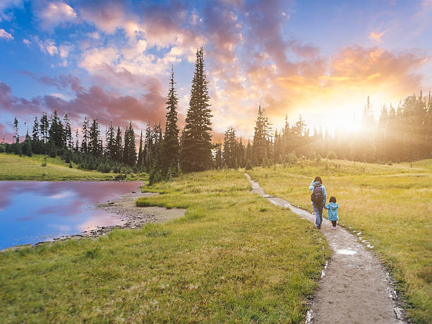 mother hiking with daughter at MT.Rainier mother hiking with daughter at MT.Rainier, aside Tipsoo Lake, MT.Rainier National Park, WA, USA. pacific northwest stock pictures, royalty-free photos & images