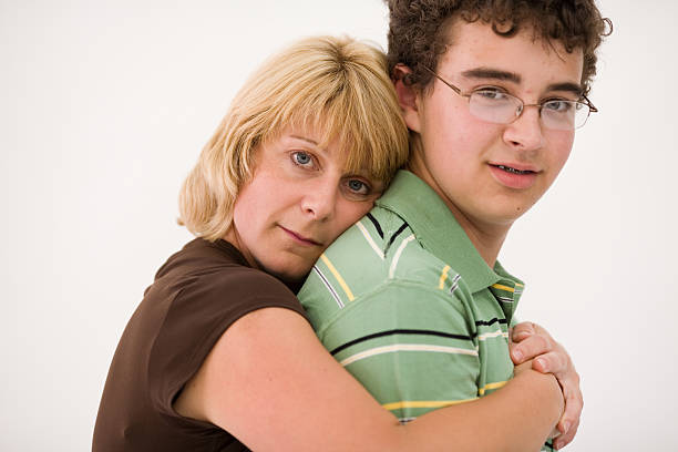 Mother & Son A single mother with her adolescent sonMore pictures from the series FAMILY LIFE: embarrassment photos stock pictures, royalty-free photos & images