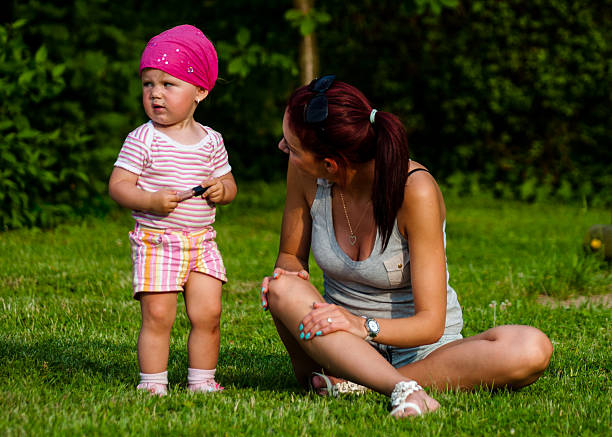 Mother talks to daughter stock photo