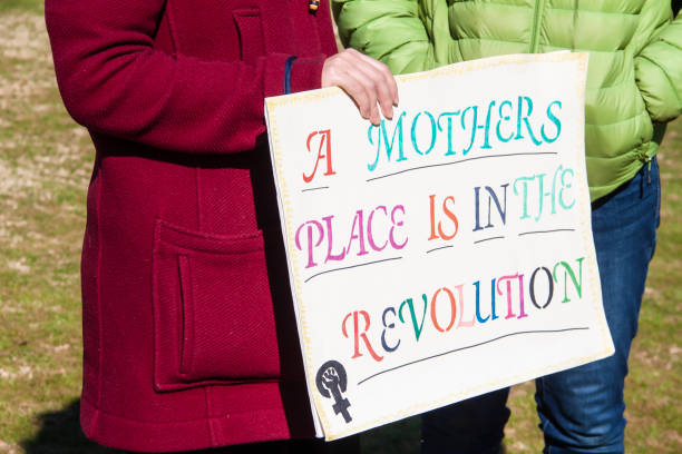 A Mothers place is in the revolution - two women holding sign at Womens March 2020 A Mothers place is in the revolution - two women holding sign at Womens March 2020 abortion protest stock pictures, royalty-free photos & images