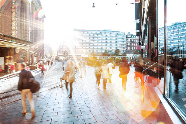 motion blur of people walking in the city - finland stok fotoğraflar ve resimler