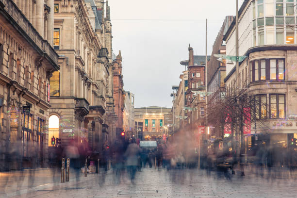 Motion blurred shoppers and commuters in Glasgow Glasgow / Scotland - February 15, 2019: a blur of shoppers and commuters during the evening rush hour on Buchanan street in the city centre high up stock pictures, royalty-free photos & images