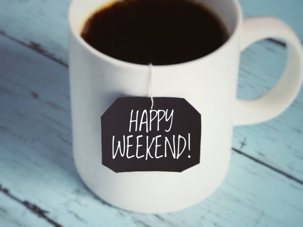 Motivational and inspirational greeting. ‘Happy weekend!’ written on a black piece of paper. With blurred vintage styled. weekend activities stock pictures, royalty-free photos & images