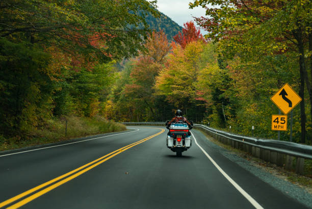 Motorcycle driving on the road on the White Mountains stock photo