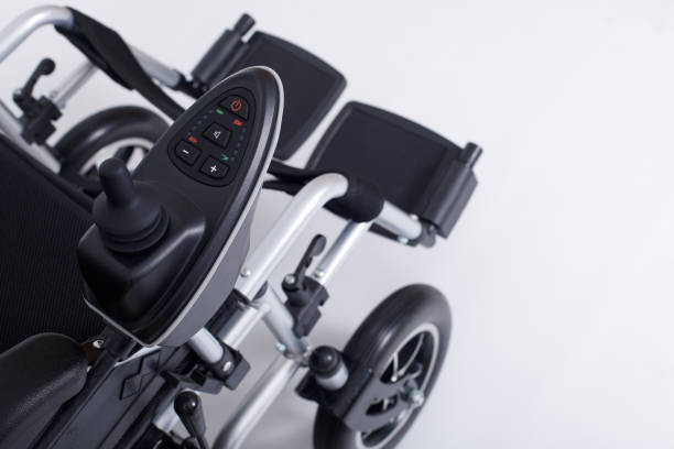 motorized electric wheelchair for senior elder patient who cannot walk, isolated - scootmobiel stockfoto's en -beelden