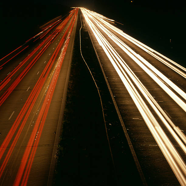 m25 motorway at night. reigate in surrey england - reigate stockfoto's en -beelden