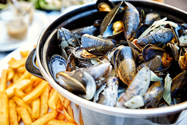 Moules mariniere with french fries stock photo