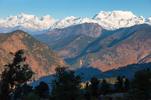 Mount Chaukhamba and woodland, Himalaya, panoramic view of Indian Himalayas mountains, great Himalayan range, Uttarakhand India, Gangotri range