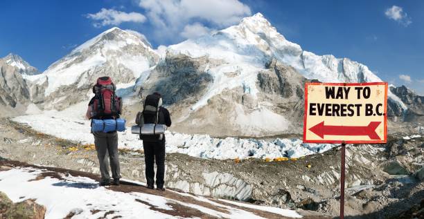 Mount Everest base camp with two tourists stock photo