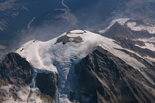 A view of the summit of Mount Rainier. The volcanic crater is visible because the photo was taken in late summer and much of the snow is melted