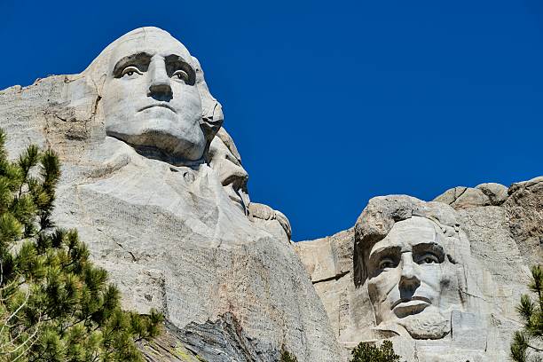 The famous Mount Rushmore National Monument in South Dakota on a sunny day featuring George Washington and Abraham Lincoln. Nice travel background. Nikon D800