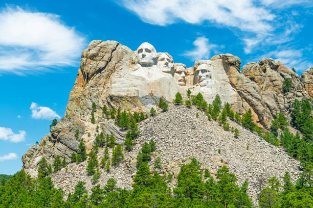 Mount Rushmore, South Dakota Wide angle view of Mount Rushmore national monument with the surrounding pine tree forest in the Black Hills near Rapid City in South Dakota, United States of America, USA. south dakota stock pictures, royalty-free photos & images