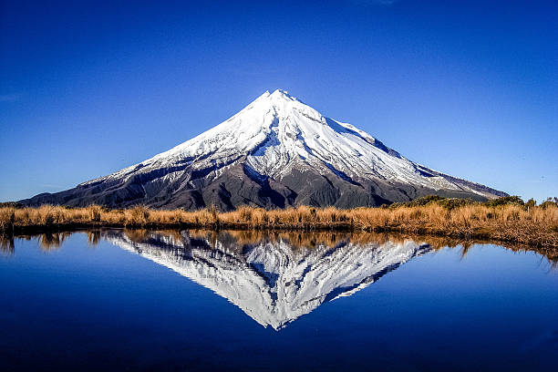 Mount Taranaki (Egmont) - New Zealand View to Mount Taranaki (Egmont) at clear sky. dormant volcano stock pictures, royalty-free photos & images
