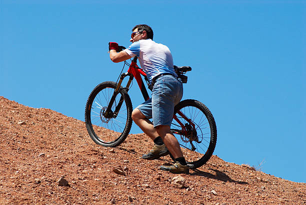 Mountain biker uphill for download stock photo