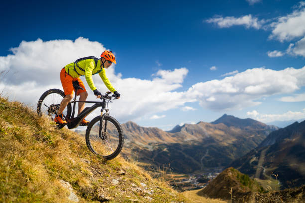 mountain biking high up stock photo