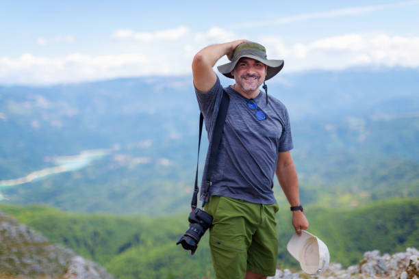 Mountain hiker photographer stock photo