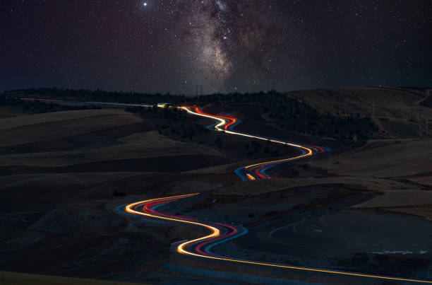 Mountain pass road at night Mountain pass road at night light trail photos stock pictures, royalty-free photos & images
