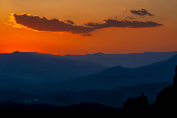 Mountain Range and Cloudy Sky at Sunset; Monasteries Area in Meteora stock photo