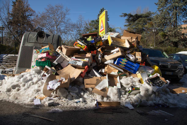 Mountains of almost frozen garbage, Madrid. Madrid, Spain - January 10, 2021: Accumulated garbage, not removed for days by the public services of the town hall, stinks half frozen by ice, after the Filomena polar cold front. public service stock pictures, royalty-free photos & images