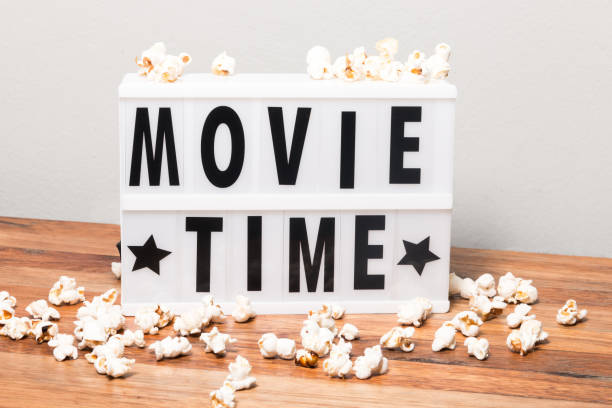 Movie time text in lightbox stock photo