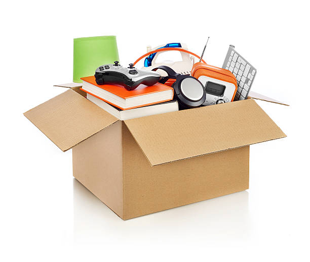 Moving box Box full of household stuff, white background manufactured object stock pictures, royalty-free photos & images