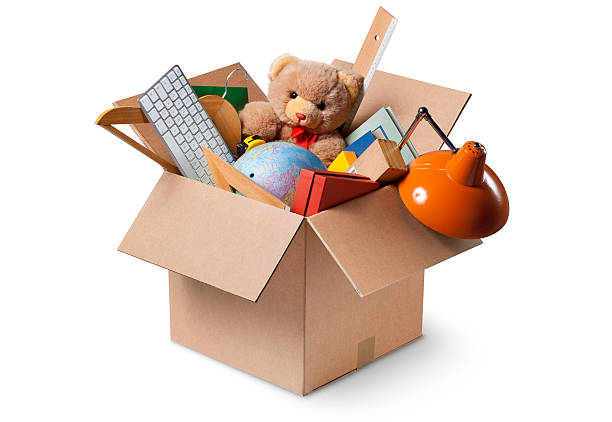 Moving house. Cardboard box with various objects. Moving house. Cardboard box with various objects.  human made stock pictures, royalty-free photos & images