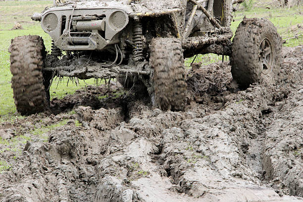 Muddy Off-road car driving through mud on 4x4 Offroad race stock photo