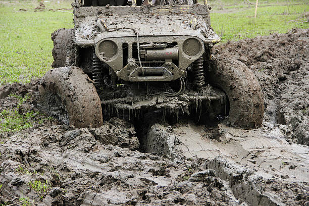 Muddy Off-road vehicle driving through mud on 4x4 Offroad race stock photo
