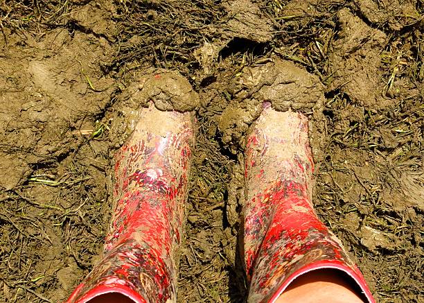 muddy wellies Wellington Boots at a music festival stock photo