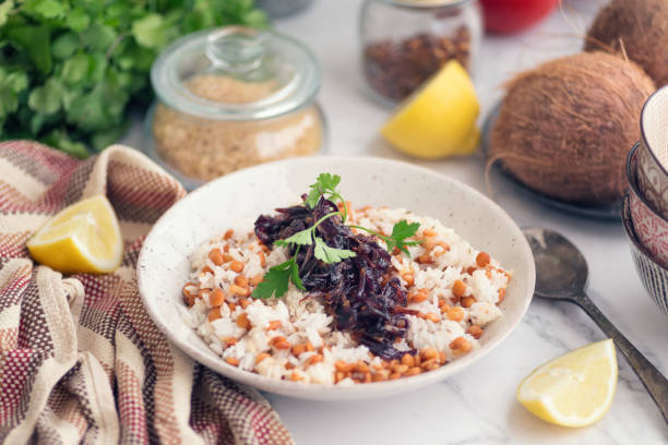 Mujaddara, lentils with rice and onionn stock photo