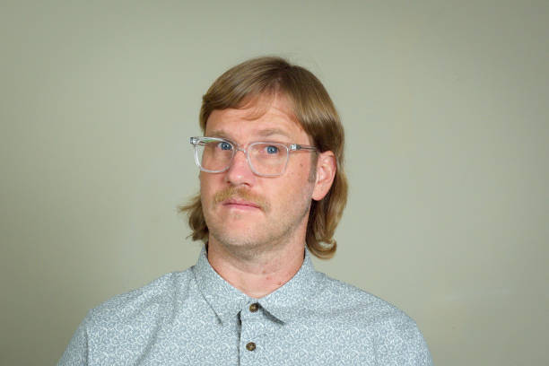 Mullet Man with mullet and glasses mullet haircut stock pictures, royalty-free photos & images