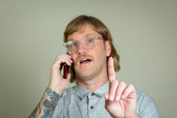 Mullet Man with mullet and glasses talking on the phone snob stock pictures, royalty-free photos & images