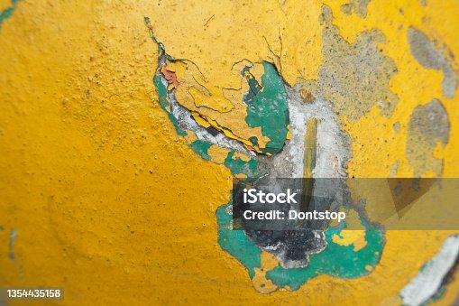 istock Multi colored Concrete cement wall with crack 1354435158