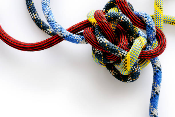Multi colored rope in a Gordian knot stock photo