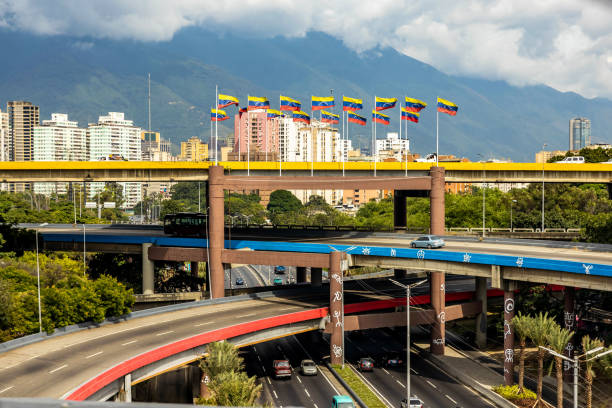 Multi level highway in center of Caracas Venezuela with national flags stock photo
