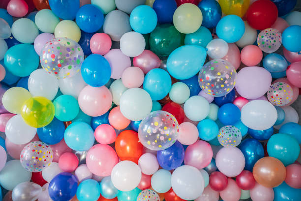Multi-colored balloons as background Multi-colored balloons as background. Helium Balloons stock pictures, royalty-free photos & images