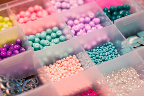 Multicolored beads Open bead container bead stock pictures, royalty-free photos & images