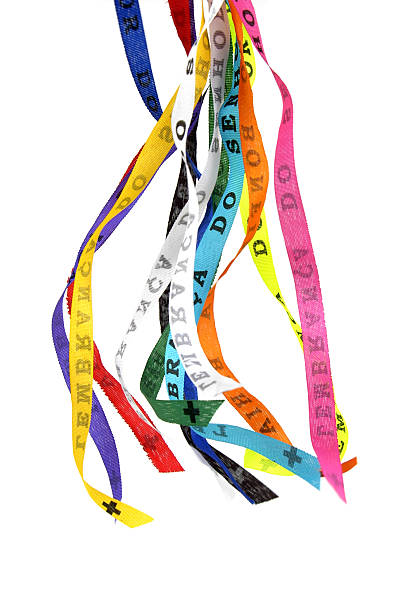 Multicolored bonfim ribbons waving against white background Typical Ribbons of Our Lord of Bonfim - Bahia, Make three wishes and they will come true bahia state stock pictures, royalty-free photos & images