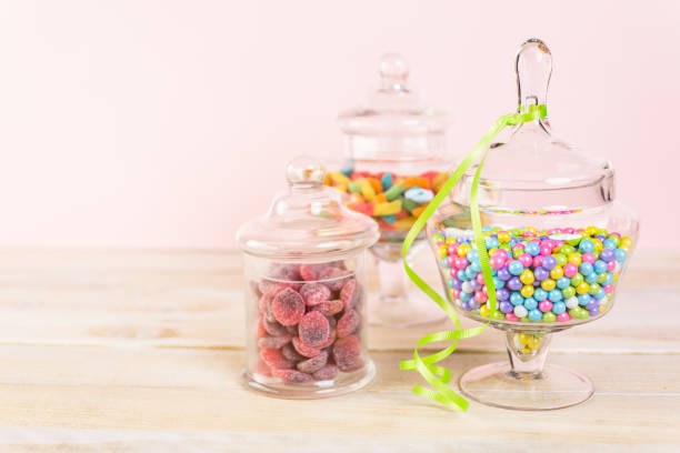 Multicolored candies Multicolored candies in glass candy jars. candy jar stock pictures, royalty-free photos & images