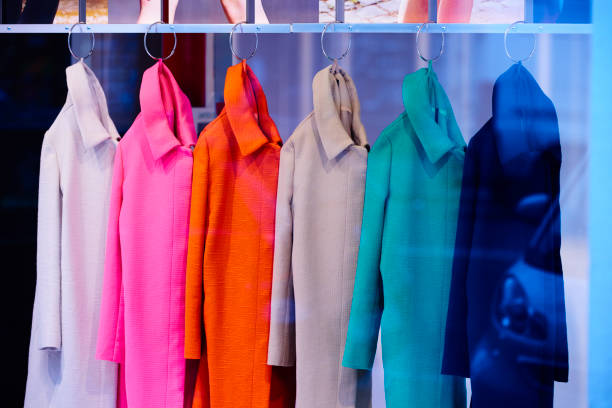 multicolored coats inside store side view of multicolored coats inside store. clothing store photos stock pictures, royalty-free photos & images