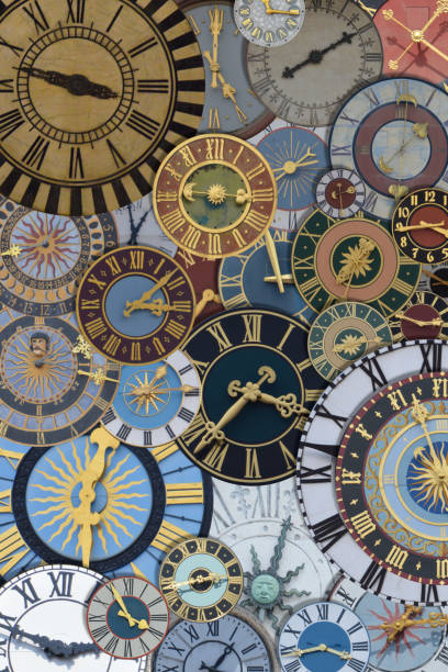 multicolored collection of ancient church tower clocks on a pile stock photo
